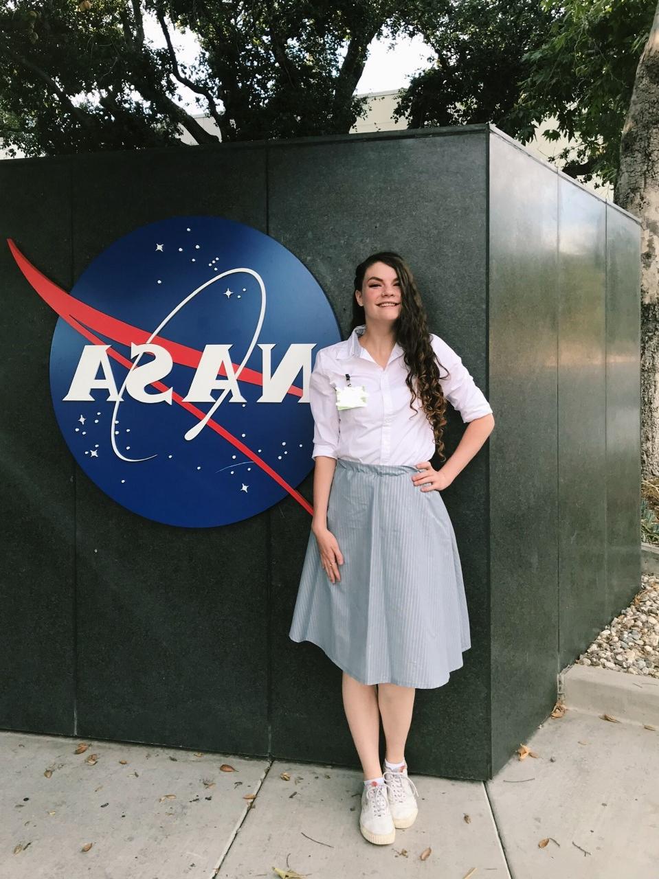 Deborah poses for photo outside of NASA